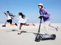 segway ninebot e3 pro electric scooter lifestyle riding trio jump