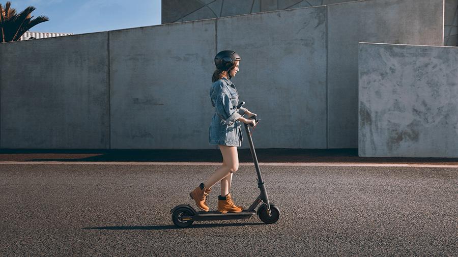 Girl riding Xiaomi Pro