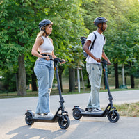 niu kqi100 pro electric scooter lifestyle pair riding