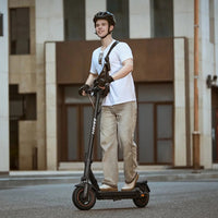 Navee GT3 Electric Scooter Lifestyle Riding Building
