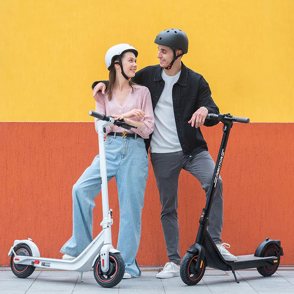 inmotion air pro electric scooter lifestyle yellow orange wall