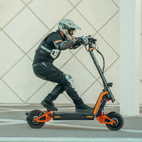 inmotion rs lite electric scooter lifestyle riding crouch